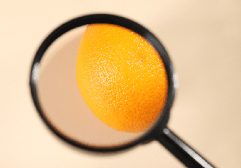 zoom sur une orange qui représente la cellulite et la peau d'orange